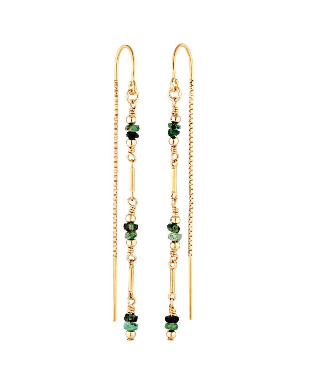 Gold earrings with green emerald beads on a white background