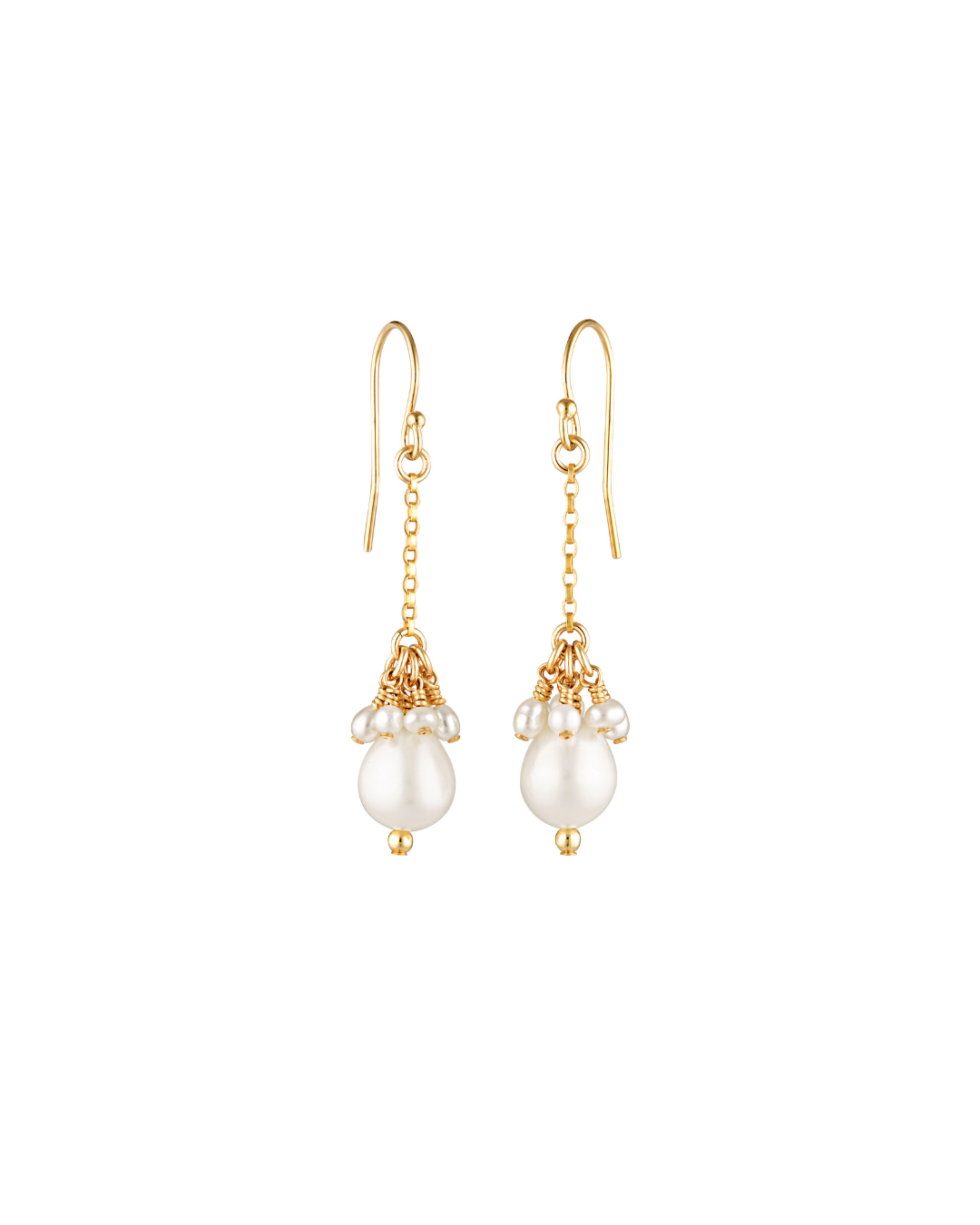 Gold earrings with pearl drops on a white background