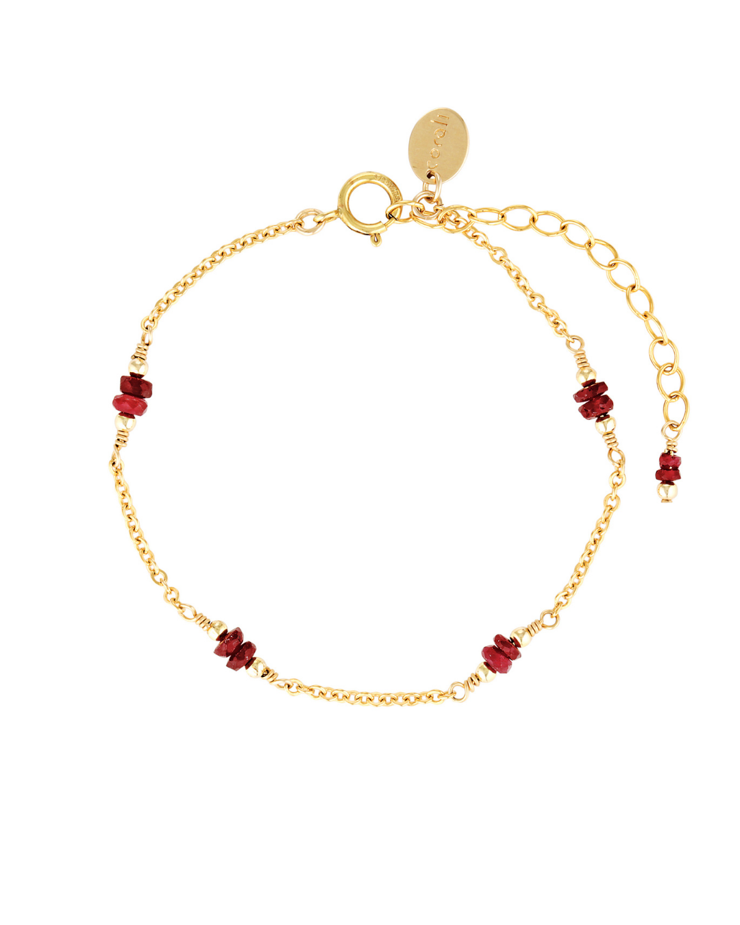 Gold bracelet with red rubies on a white background