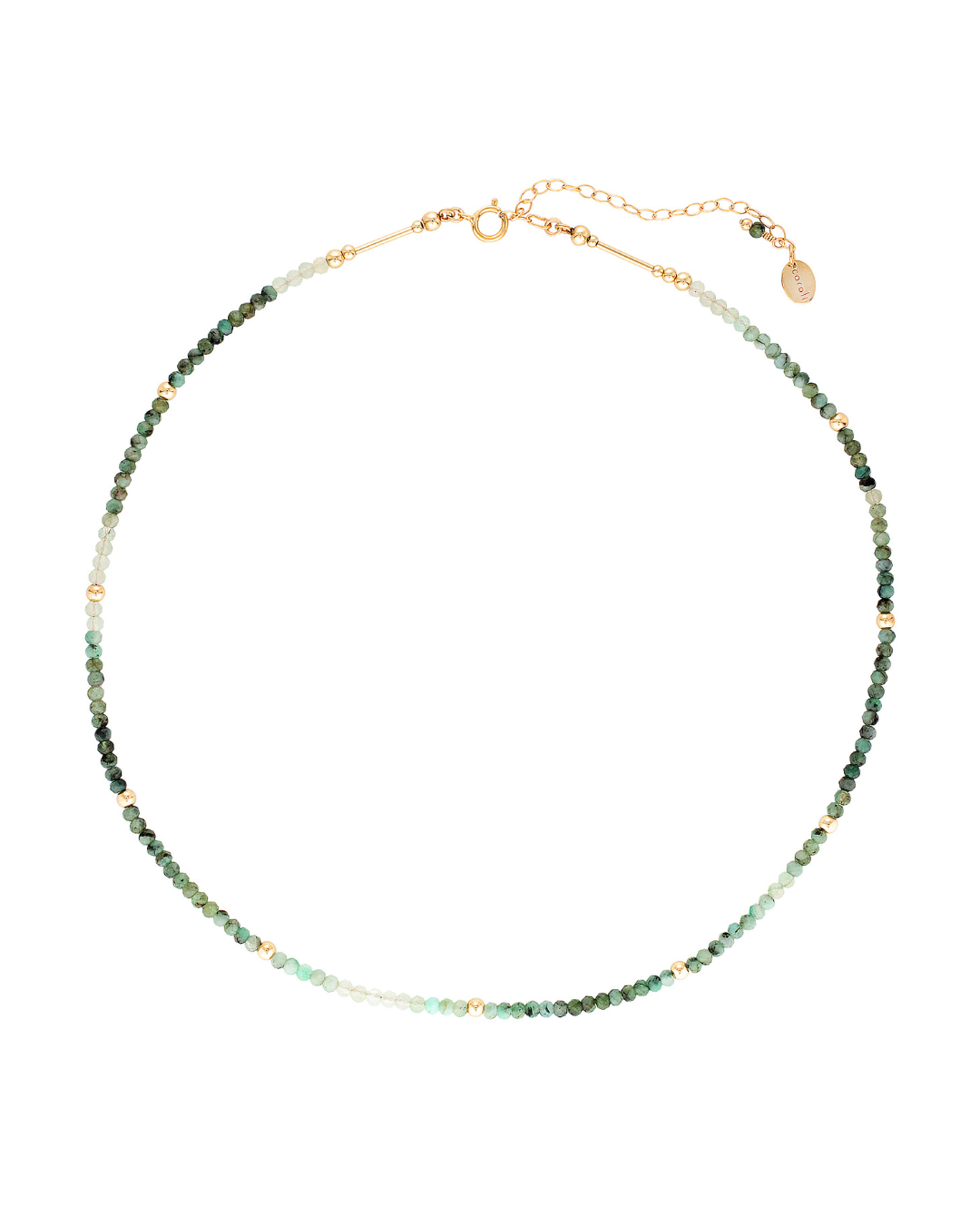 Gold and emerald gemstone necklace on a white background