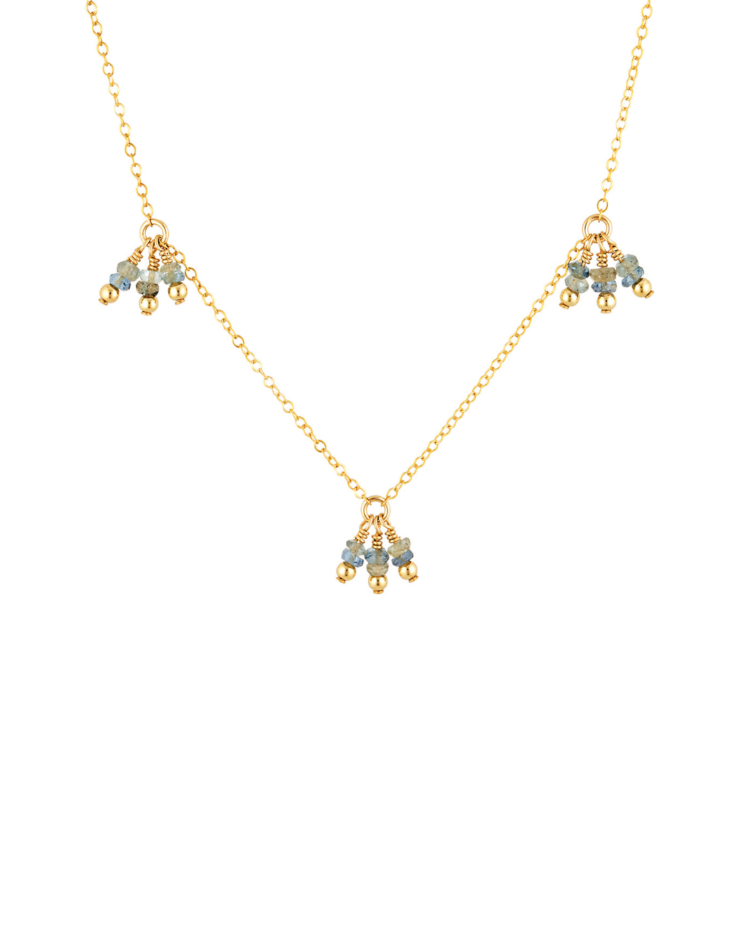 Gold necklace with small pendants on a white background