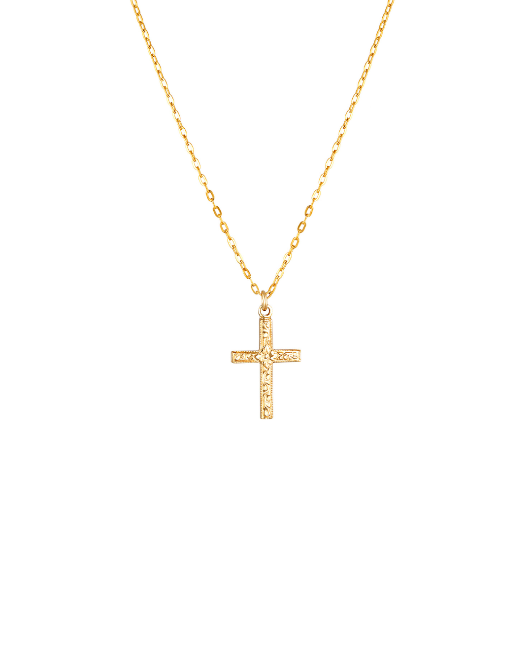 Gold cross necklace on a white background