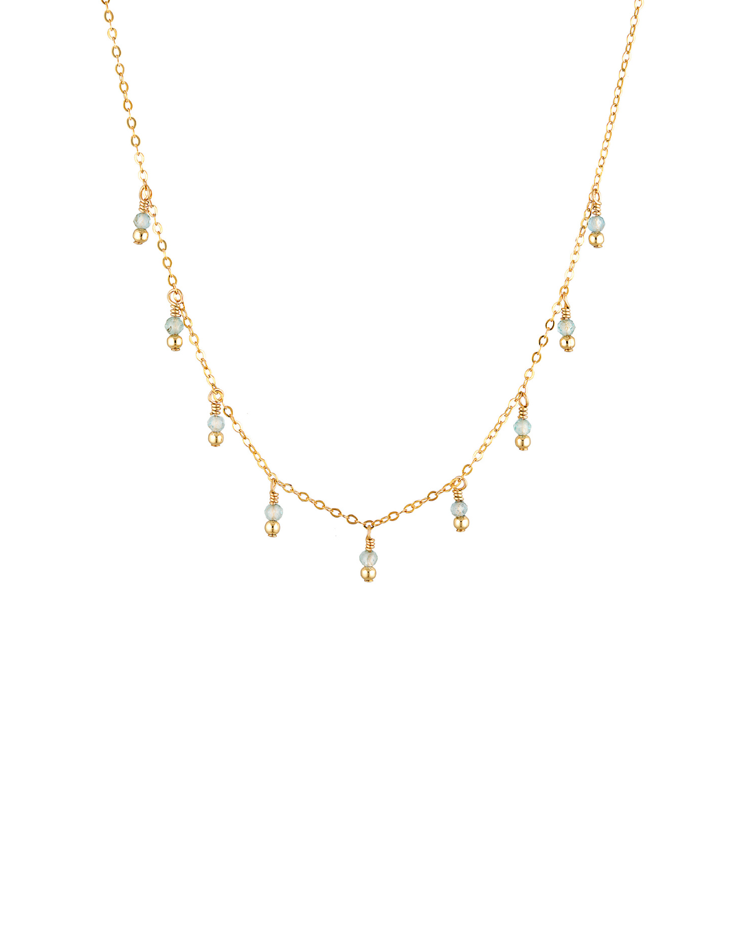 Delicate gold apatite gemstone necklace on a white background