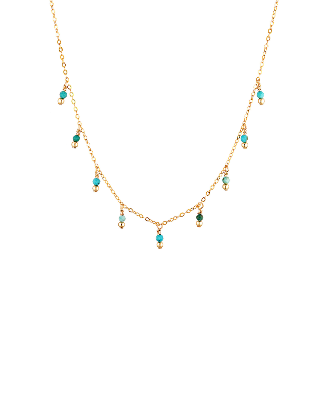 delicate gold necklace with turquoise gemstones on a white background
