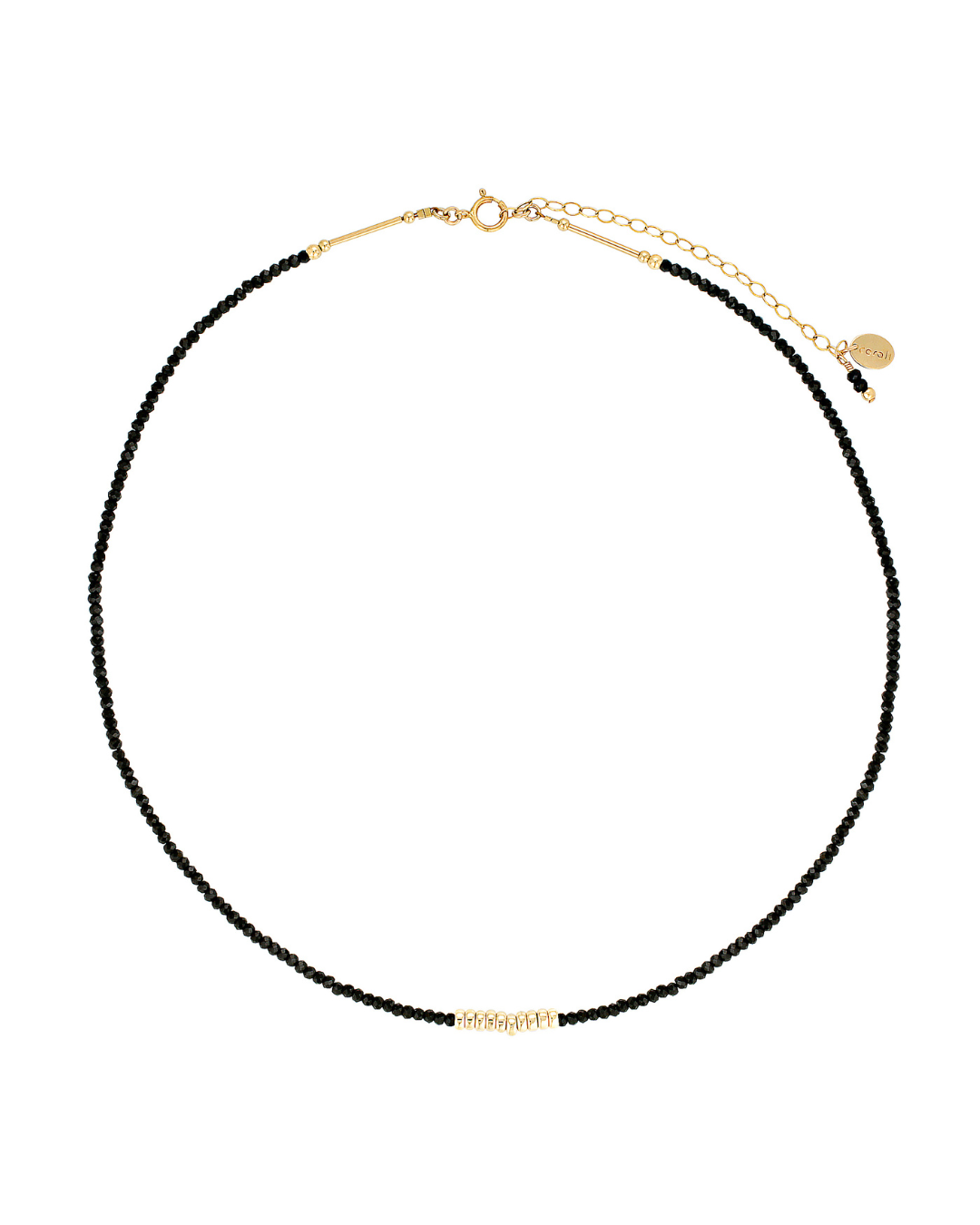 Gold necklace with black spinel gemstones on a white background