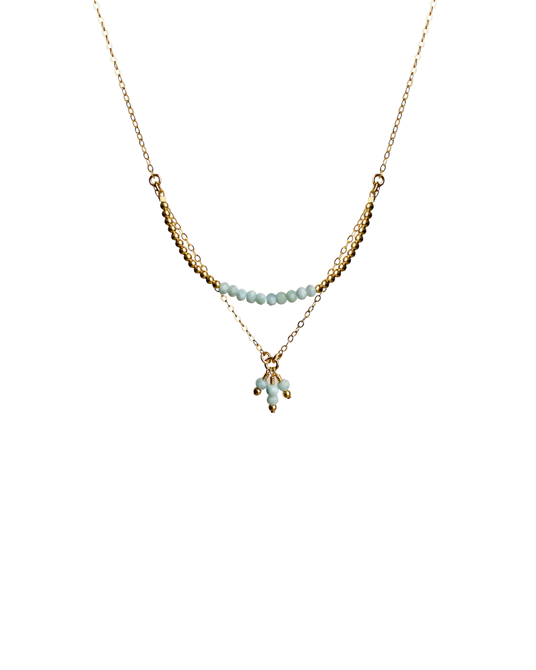 Gold necklace with larimar gemstones on a white background