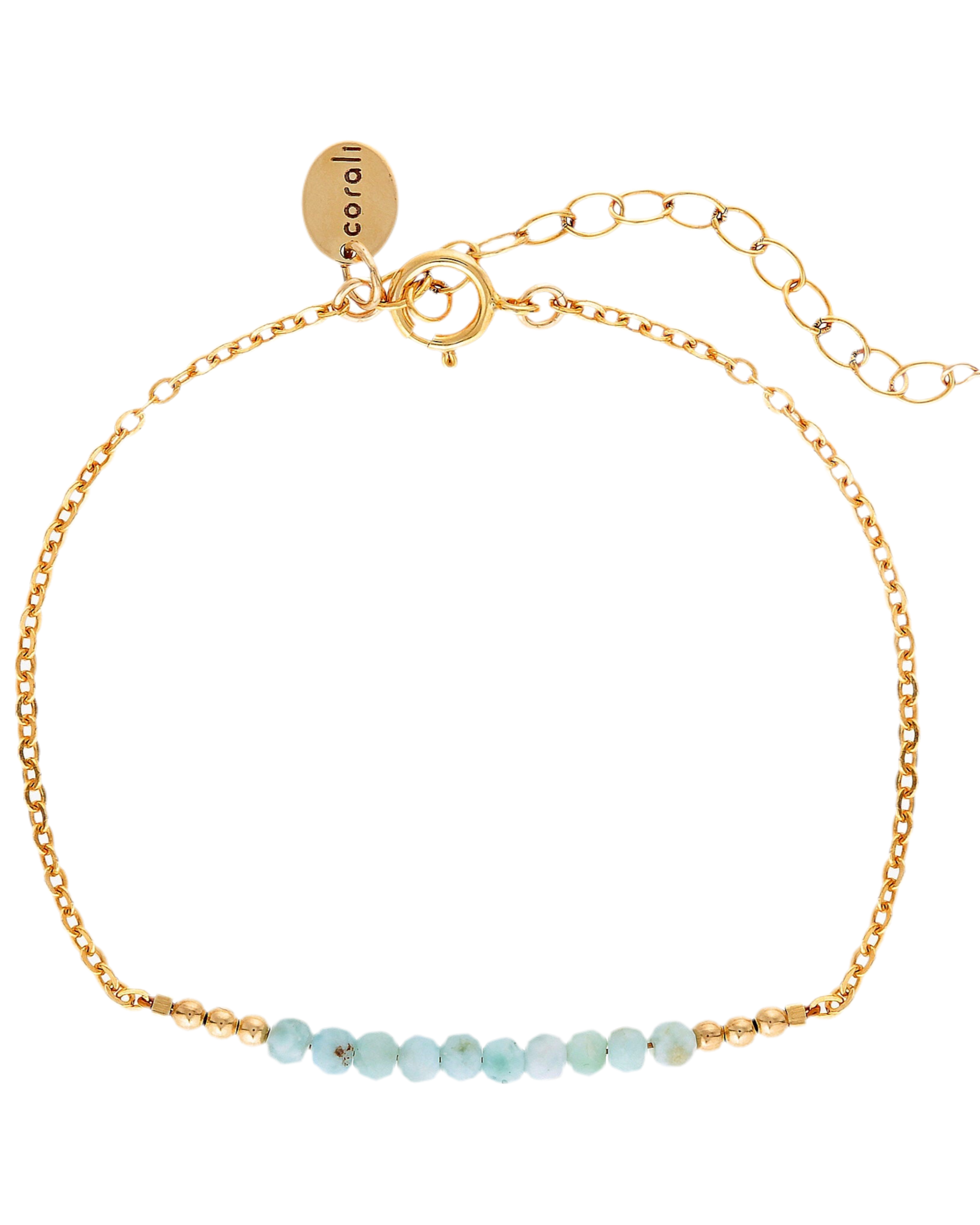 Gold bracelet with small larimar beads on a white background