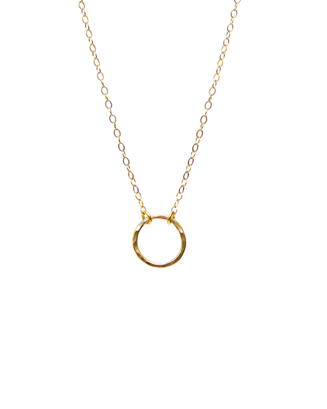 Gold necklace with a small circular pendant on a white background