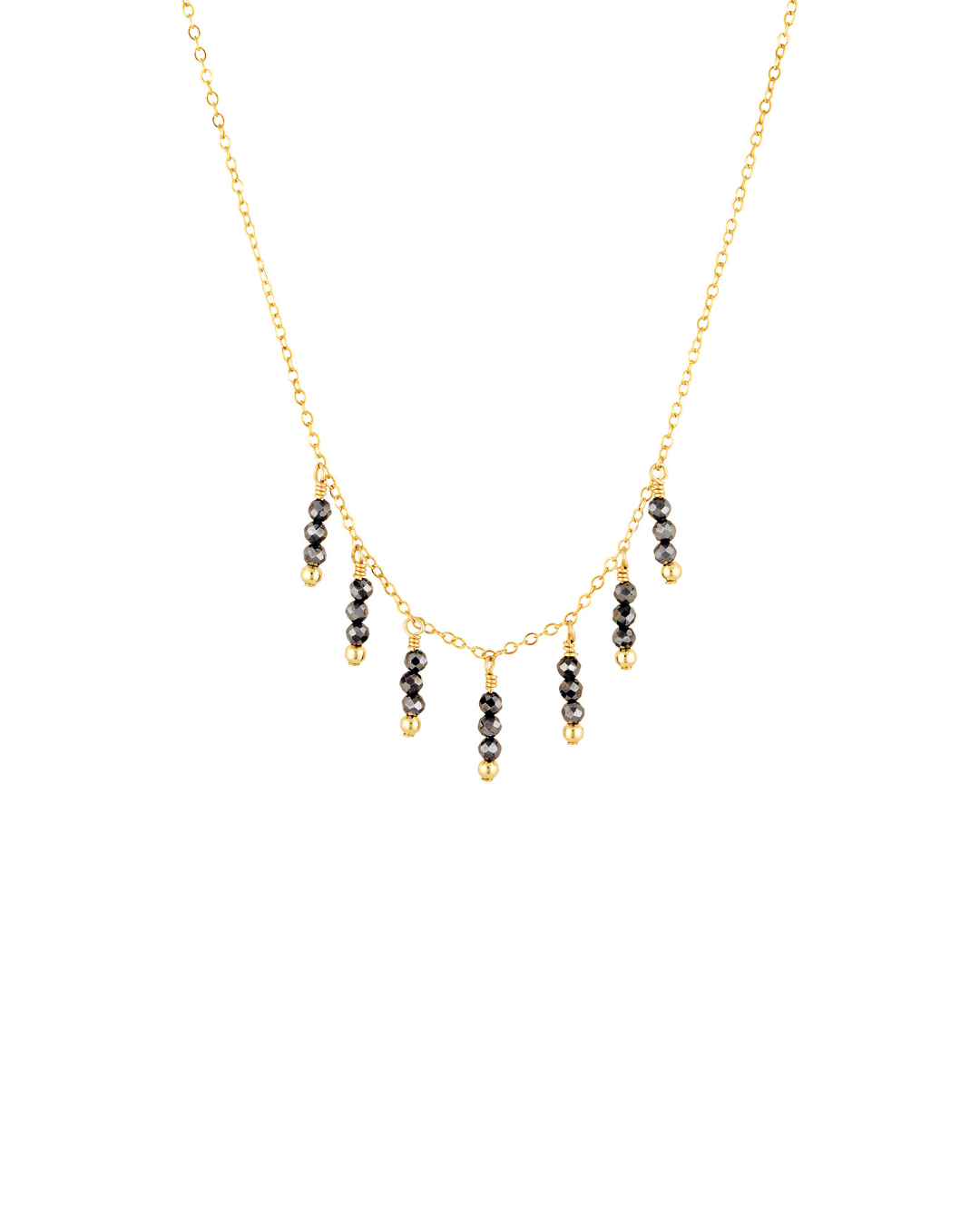 Necklace with black spinel beads on a gold chain against a white background
