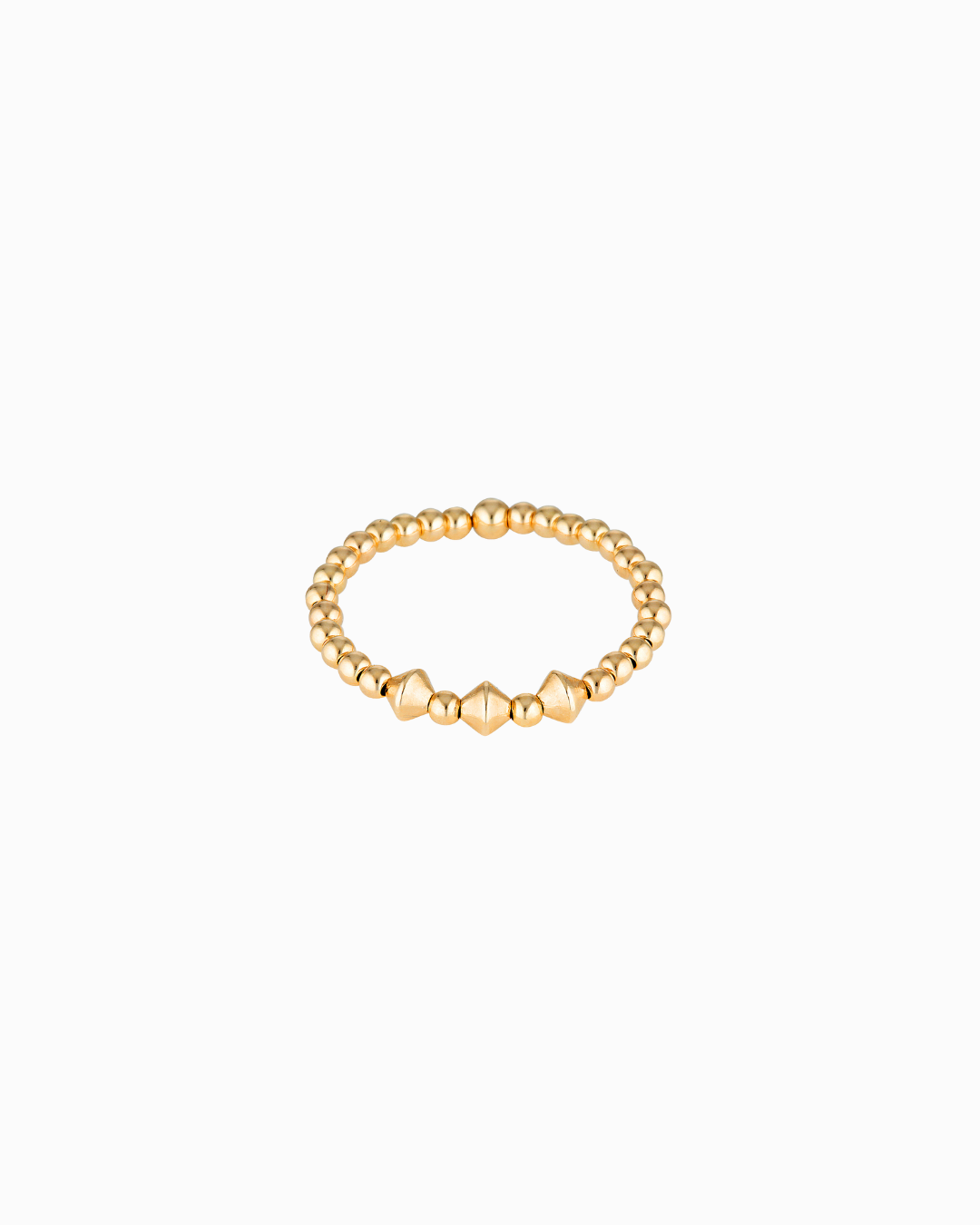 Gold beaded ring on a white background