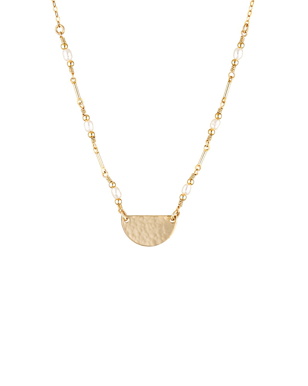 Gold necklace with a half-circle pendant and pearls on a white background