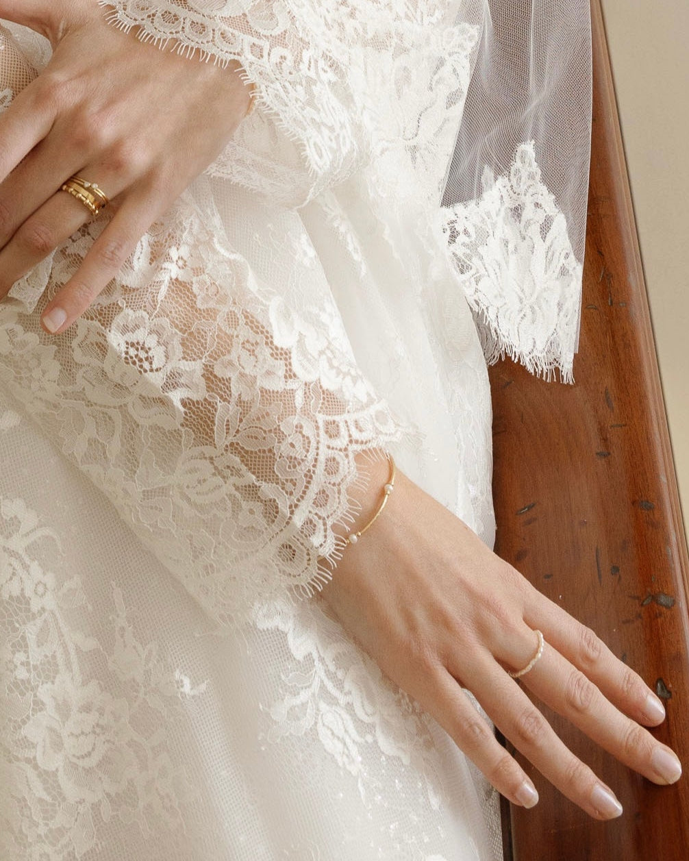 Close-up of a bride's hand wearing a and pearl bracelet and ring