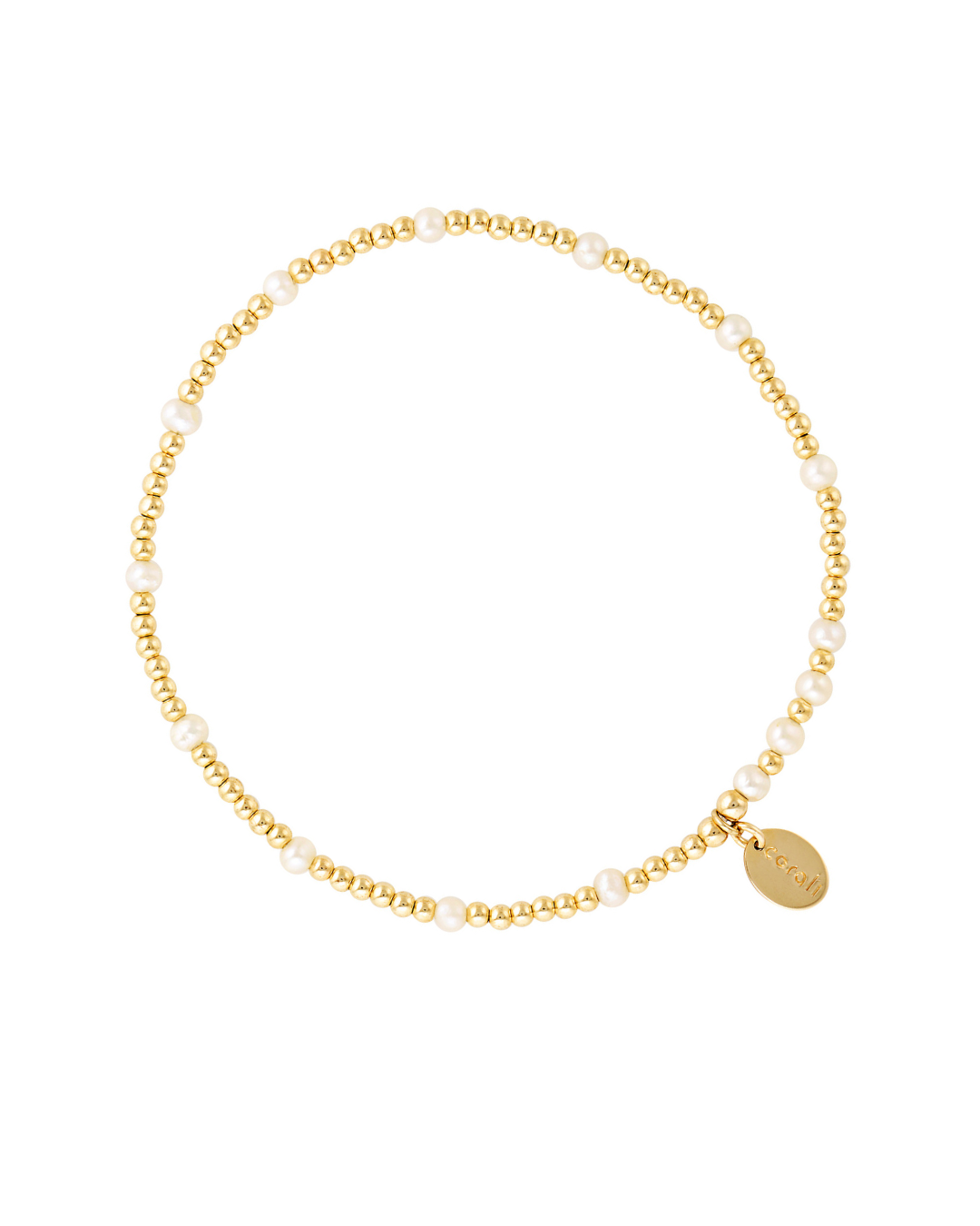 Gold and pearl bracelet on a white background