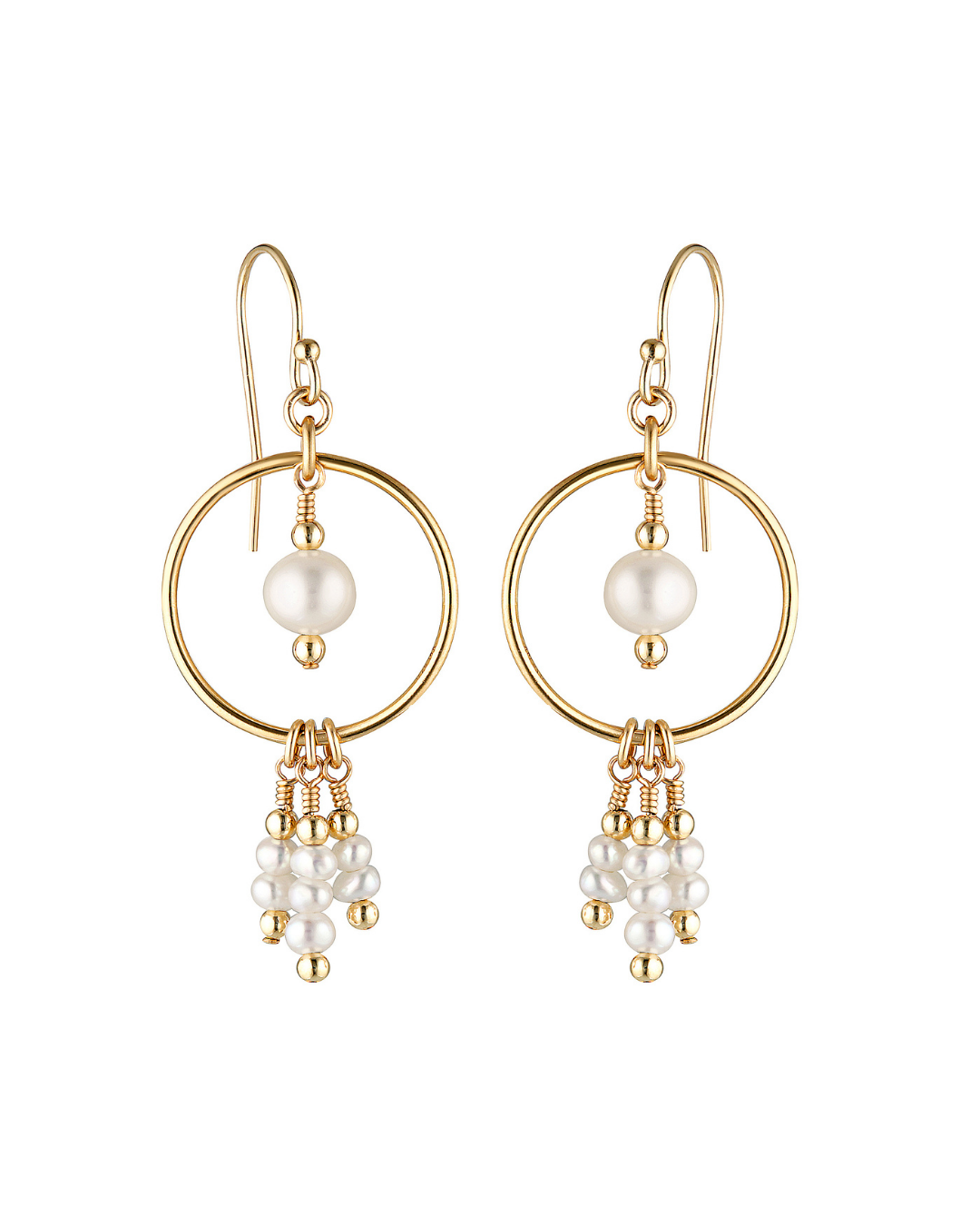 Gold hoop earrings with pearl drops on a white background