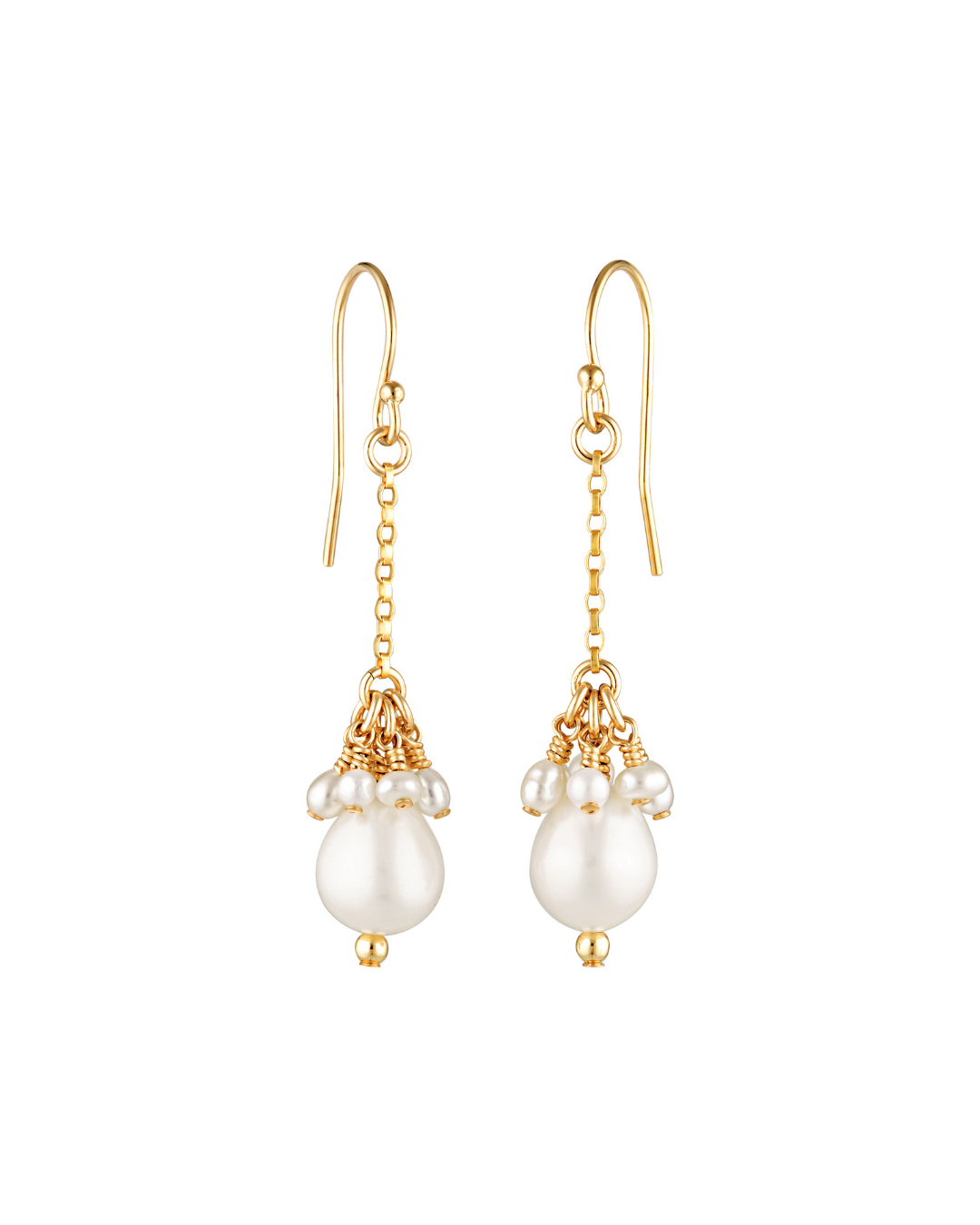 Gold earrings with pearl drops on a white background
