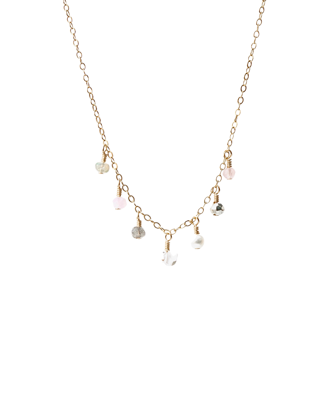 Delicate gold necklace with small beads on a white background