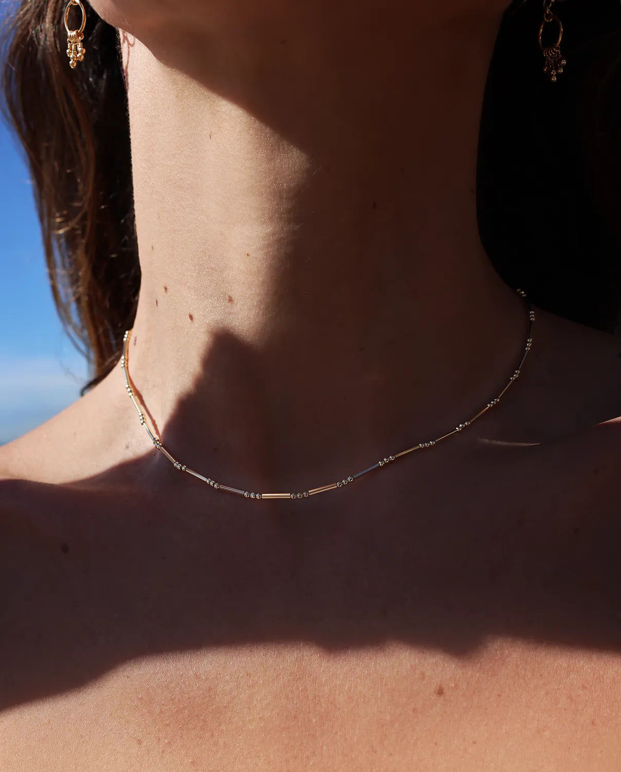 Choker necklace hand-beaded with a mix of fine round and sleek tube beads
