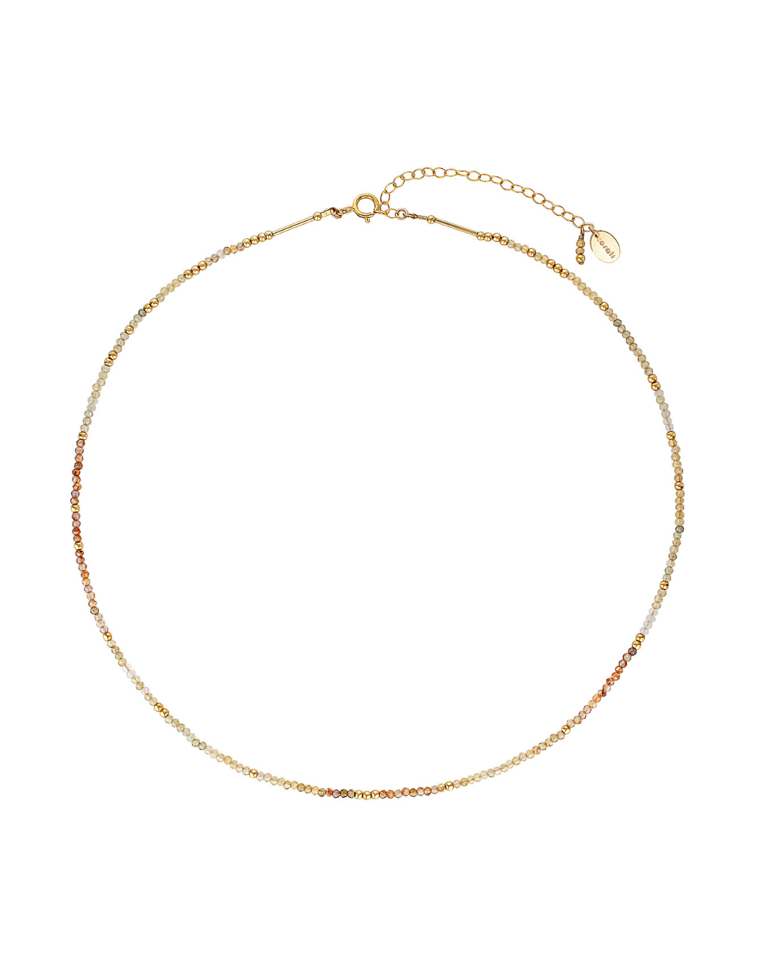Gold necklace with zircon gemstones on a white background