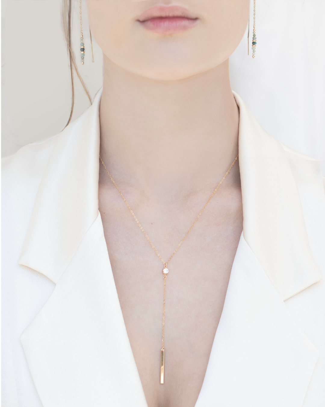 Bride wearing a Gold and Cubic Zirconia gemstone lariat necklace 