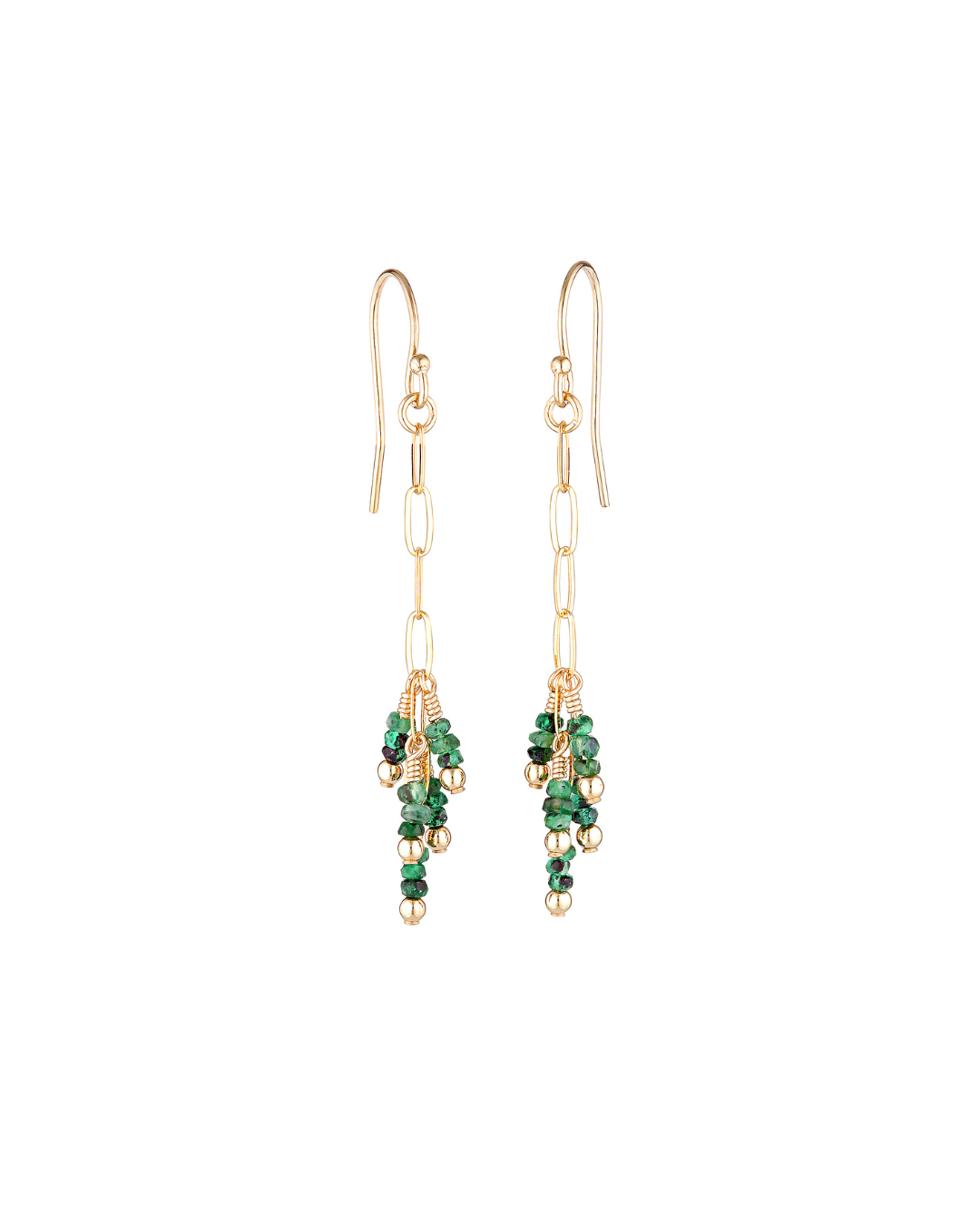 Gold earrings with green emerald gemstones on a white background