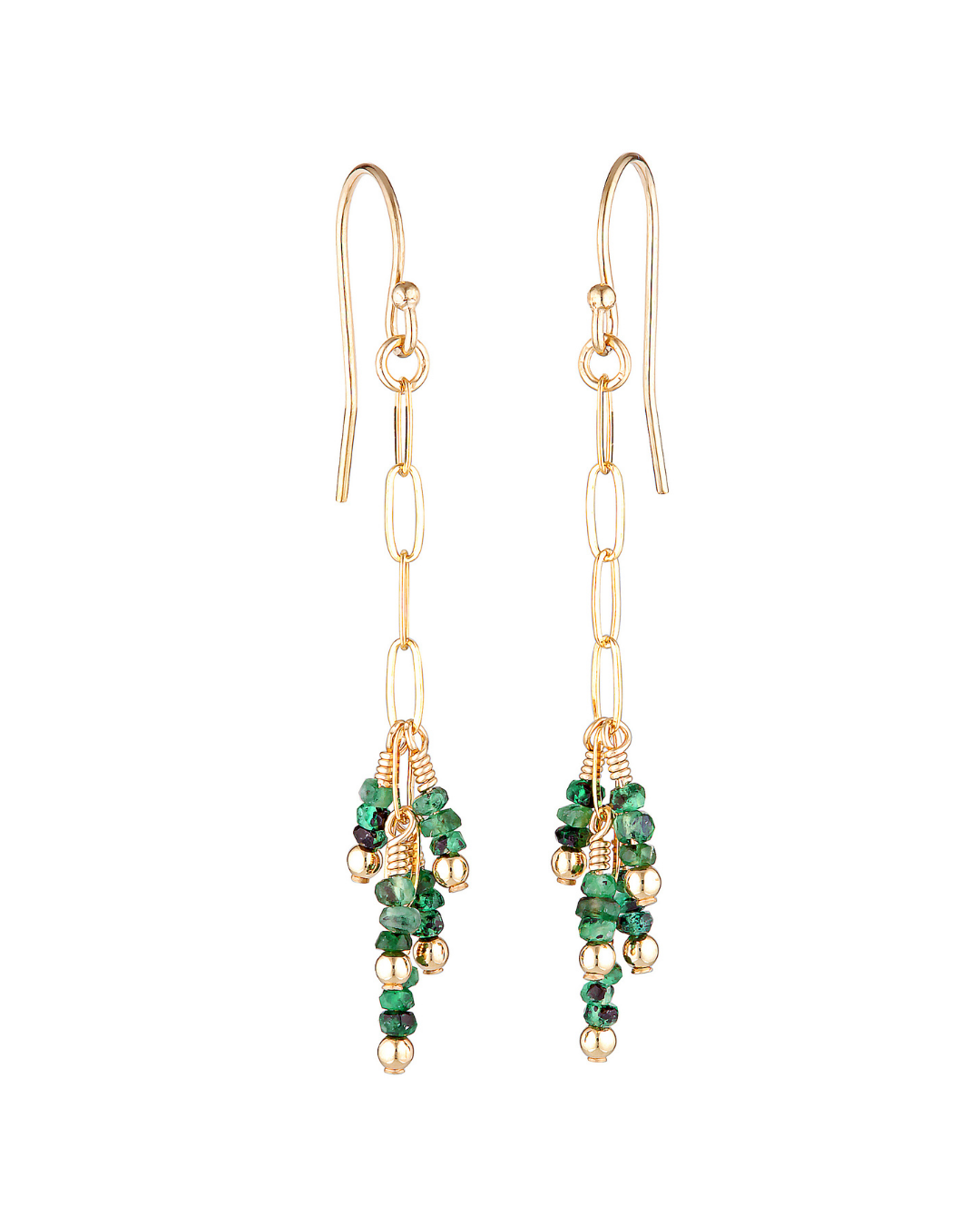 Gold earrings with green emerald beads on a white background