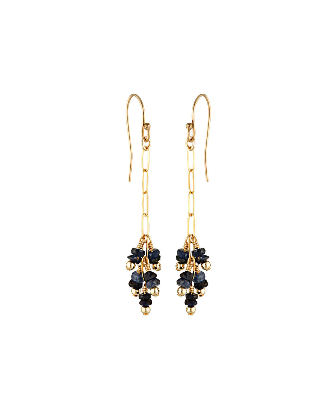 Gold earrings with blue sapphire gemstones on a white background