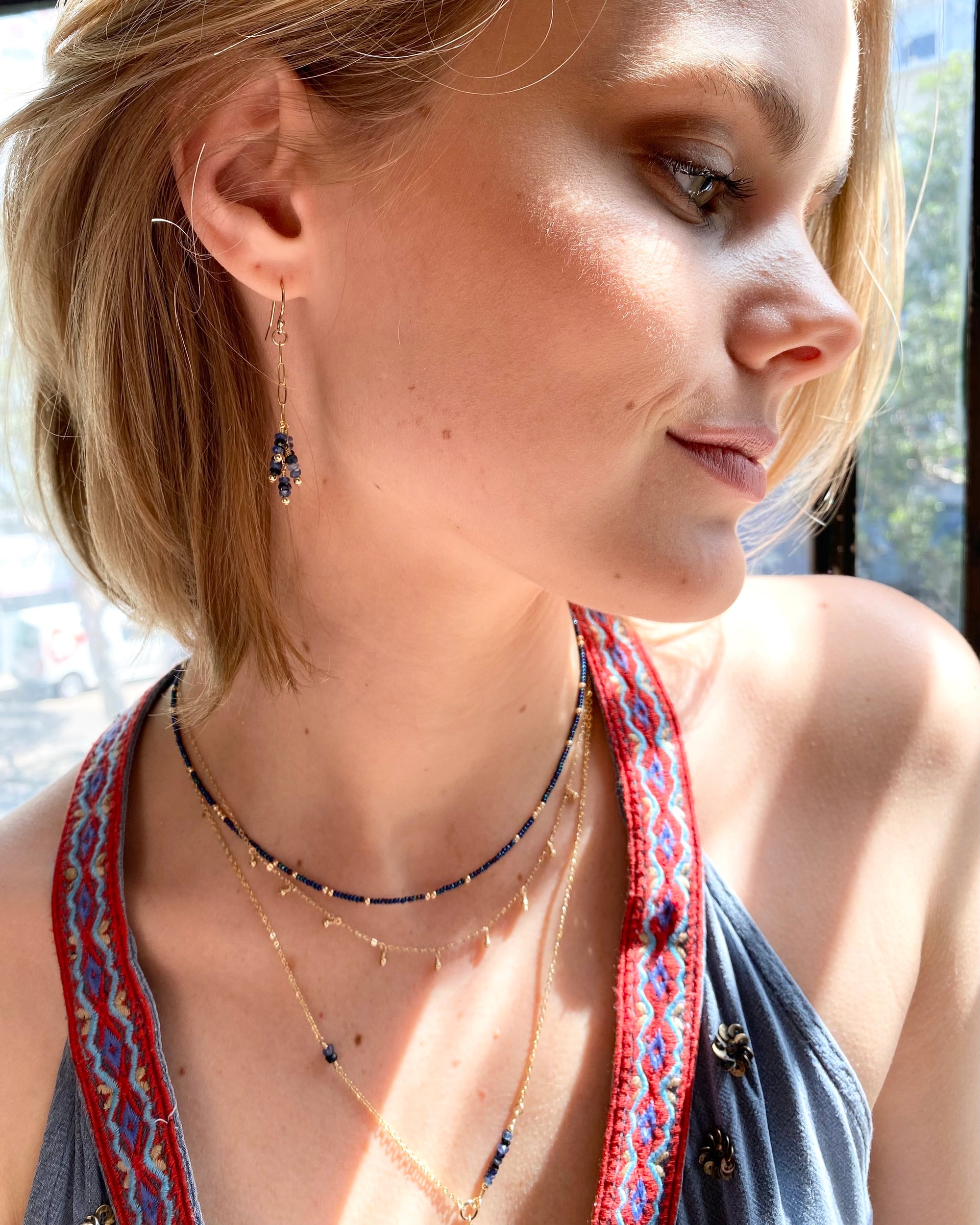 dangle gold earrings with blue sapphire gemstones