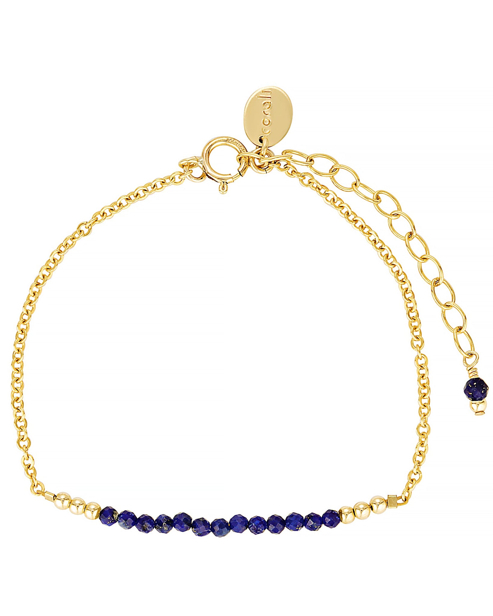 Gold bracelet with blue lapis lazuli gemstones on a white background