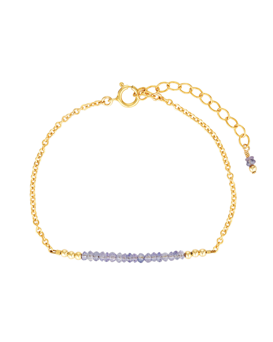 Gold bracelet with a bar of purple blue tanzanite beads on a white background