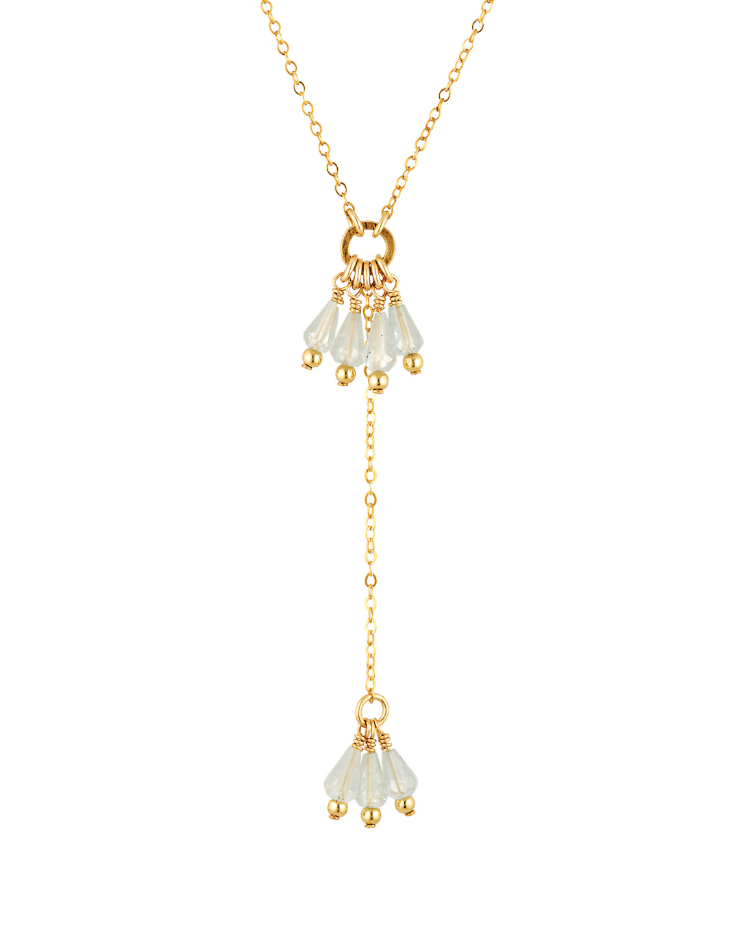 Gold necklace with white gemstone pendants on a white background