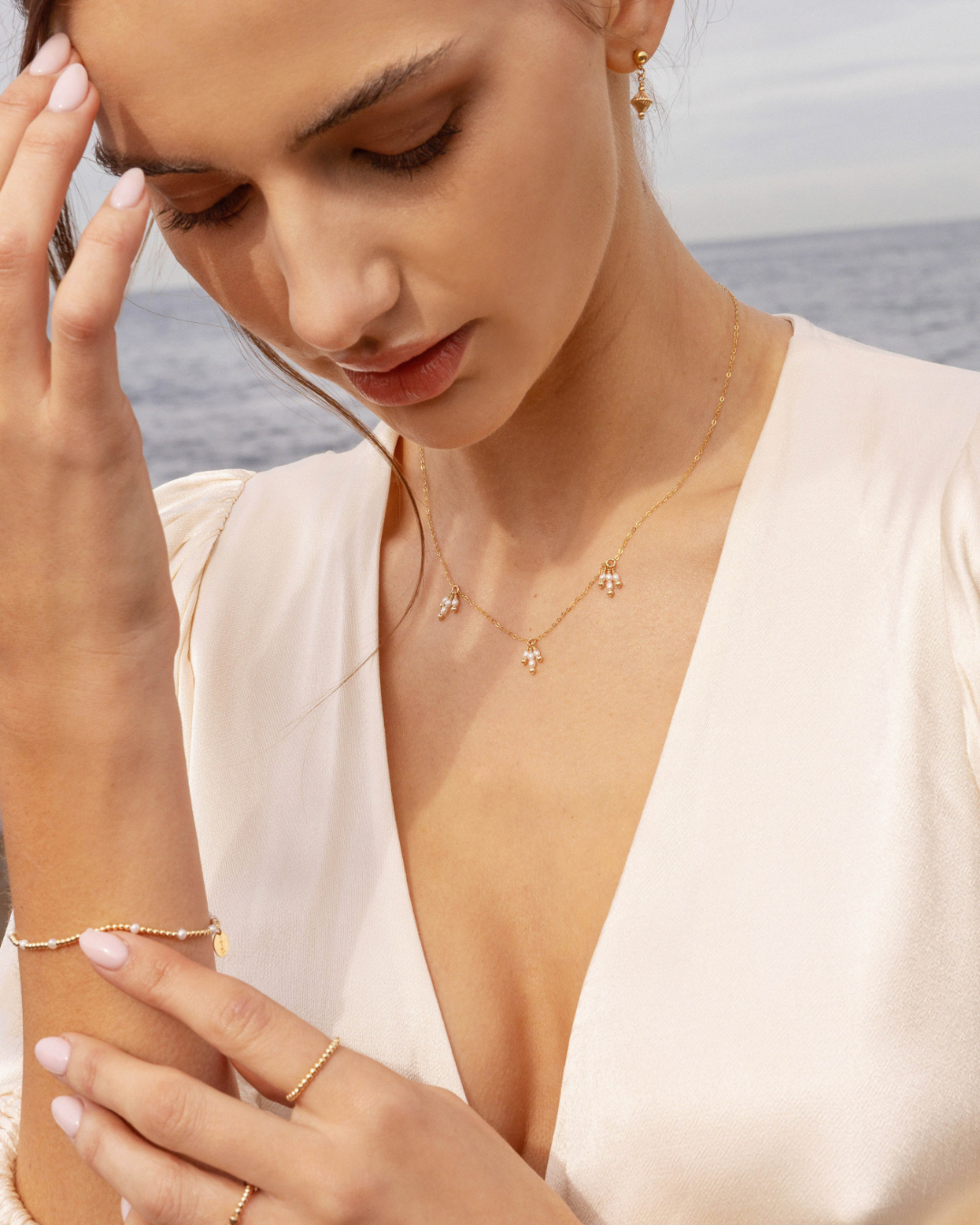 Close up of woman wearing gold jewellery