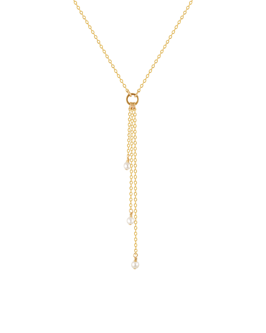 Gold chain necklace with round pearls suspended from chain on white background.