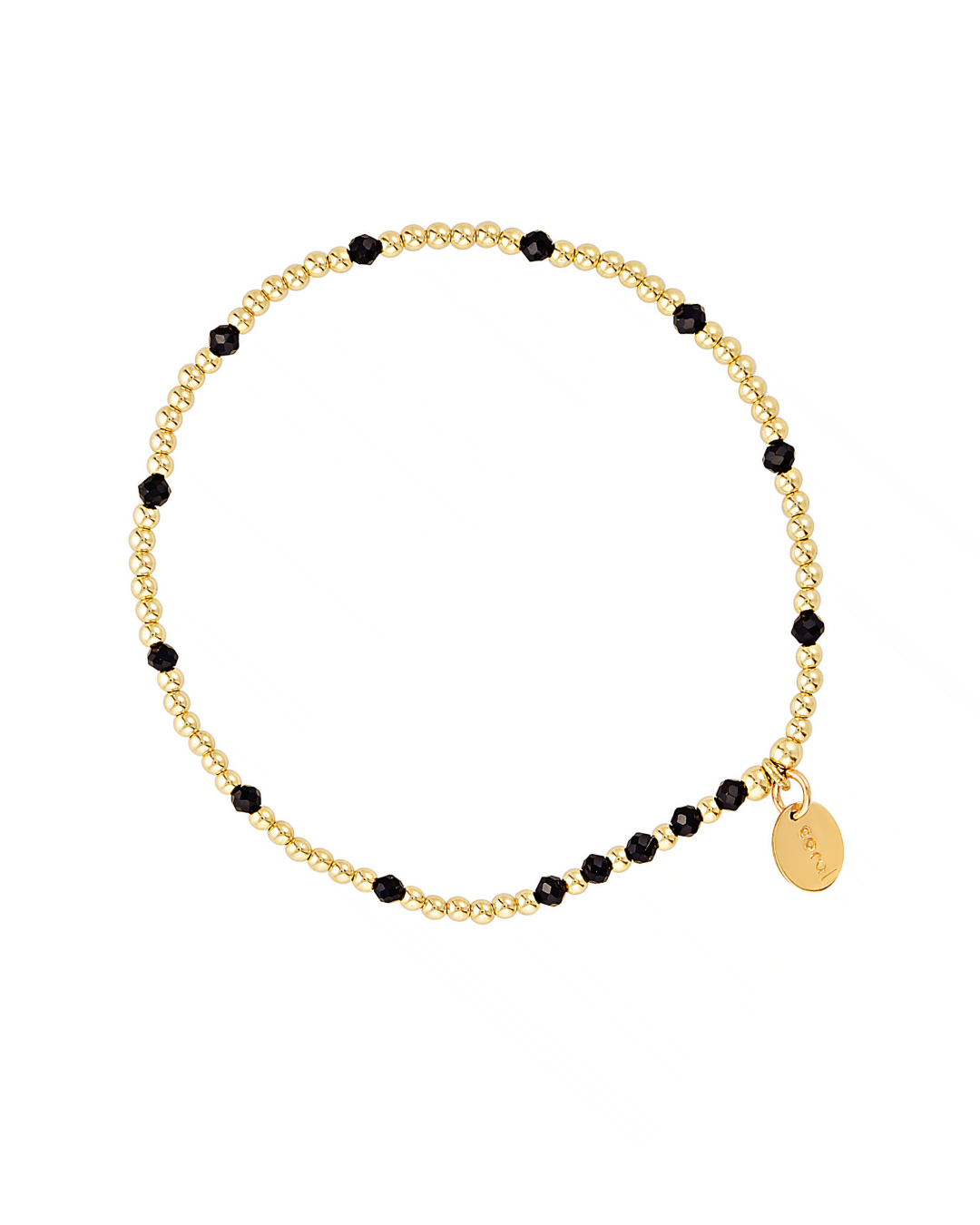 Gold bracelet with black spinel gemstones on a white background