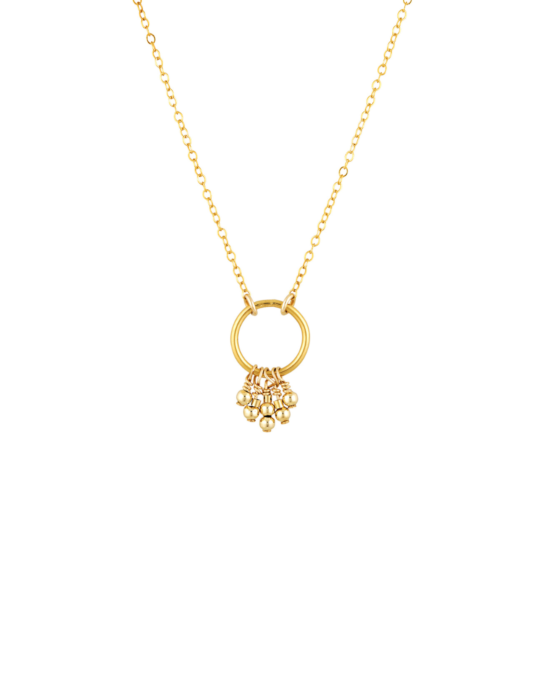 Gold necklace with a circular pendant and small beads on a white background