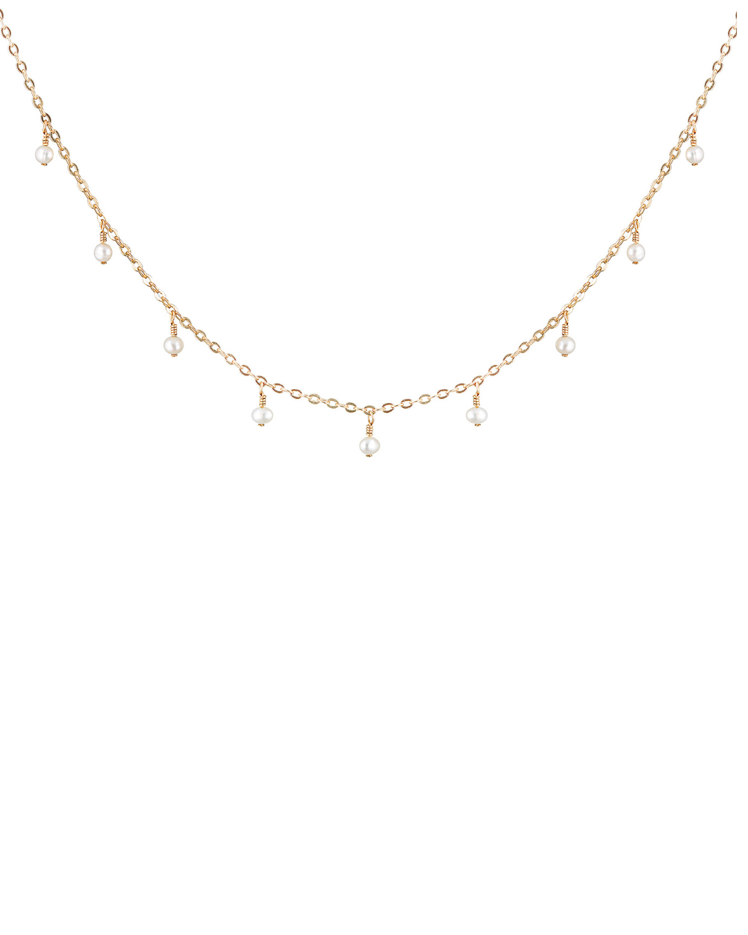 A fine gold necklace with suspended dangly round pearls, with a petite charm at the end.