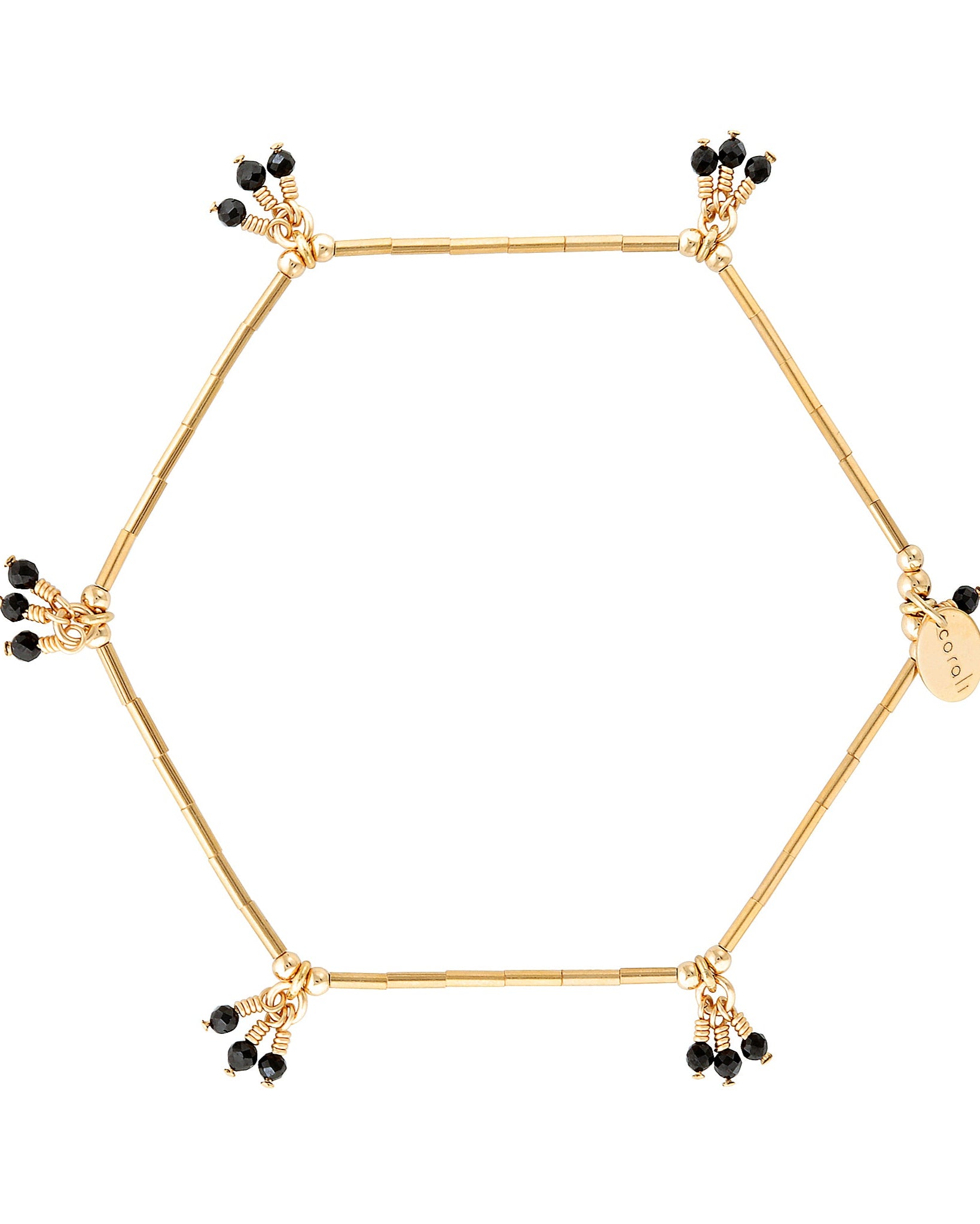 A gold bracelet with black spinel gemstones and gold accent beads, wire-wrapped and strung on stretch cord.